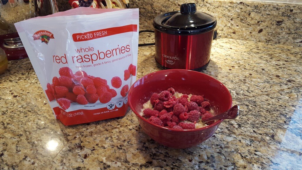 Add frozen raspberries to cool the oatmeal down.